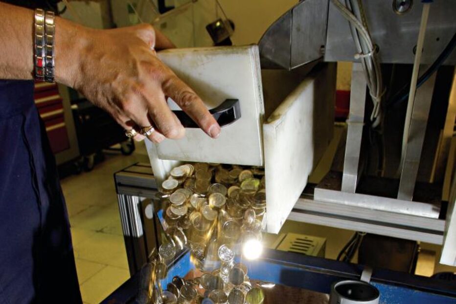 A máquina de fazer moedas