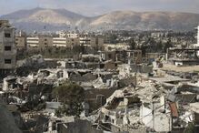 06-01-2015_21_40_48 1 - A general view shows damaged buildings in Jobar, a suburb of Damascus.JPG