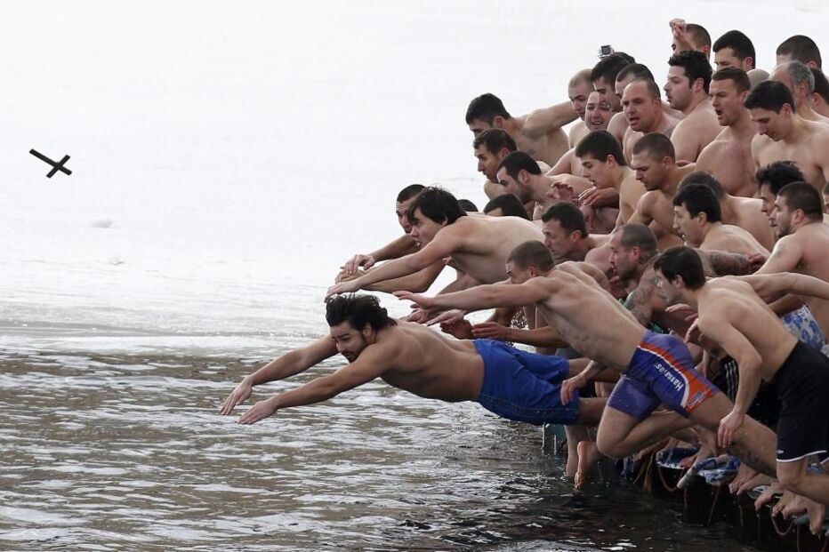 06-01-2015_21_39_28 8 - Men jump into the waters of a lake in an attempt to grab a wooden cross on Epiphany Day in Sofia.JPG