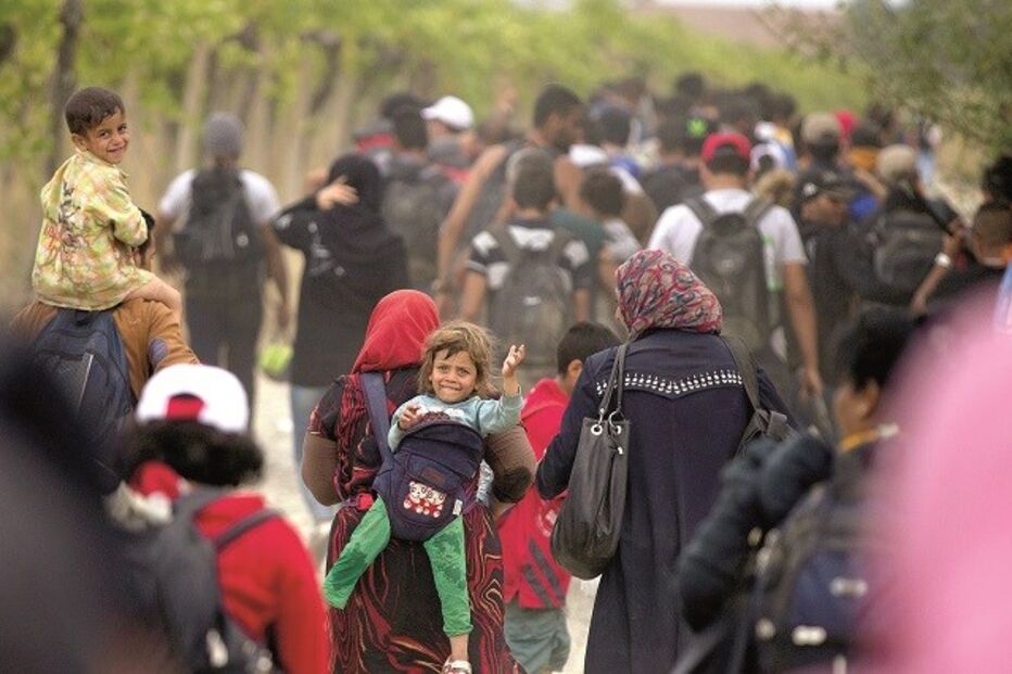 07-09-2015_00_53_32 26-27 refugiados.jpg