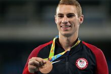 Jogos Olímpicos, Estados Unidos, imposto, Michael Phelps, Simon Biles, desporto, eventos desportivos