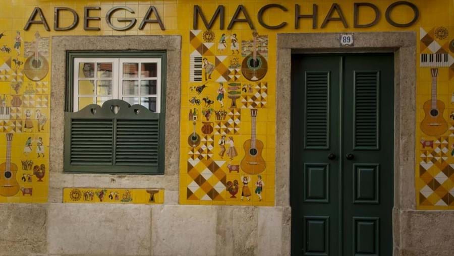 The beautiful façade of the Adega Machado is covered in painted tiles