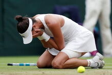 Muguruza comemora vitória em Wimbledon