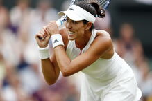 Muguruza comemora vitória em Wimbledon