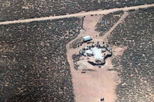 Polícia resgata 11 crianças de caravana e encontra restos mortais de menino