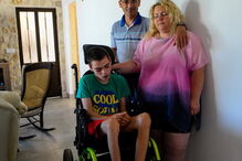 Conceição Lourenço e Carlos Filipe com o filho, David, de 12 anos 