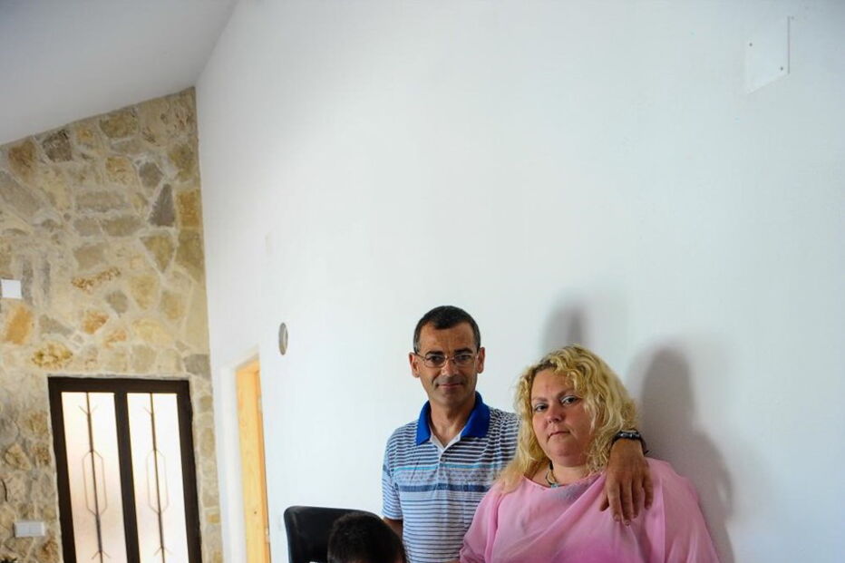 Conceição Lourenço e Carlos Filipe com o filho, David, de 12 anos 