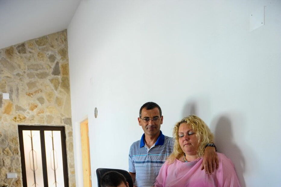 Conceição Lourenço e Carlos Filipe com o filho, David, de 12 anos 