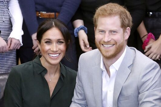 Principe Harry com a mulher, a duquesa Meghan Markle