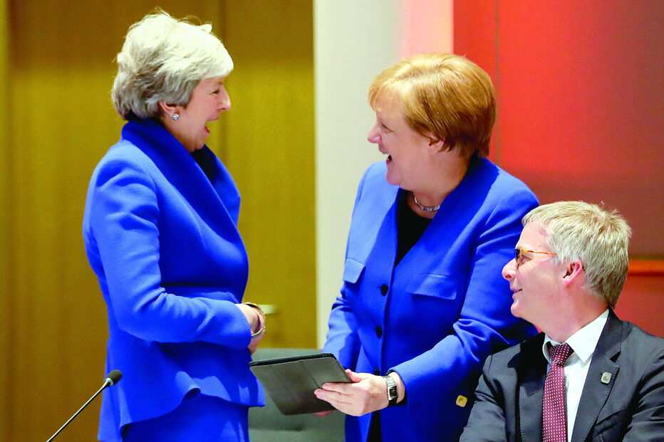 May e Merkel num momento bem-disposto antes das decisões difíceis