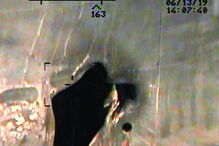 Buraco aberto por bomba no casco