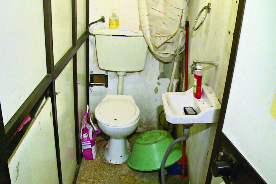 Baratas e lixo em garagem sem água quente para gémeas em bairro da Amadora