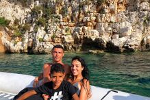 Cristianinho com Cristiano Ronaldo e Georgina