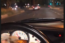 2021-08-17_11_00_06 Alexandre Esteves de Oliveira conduz com a filha Mariana ao colo.png