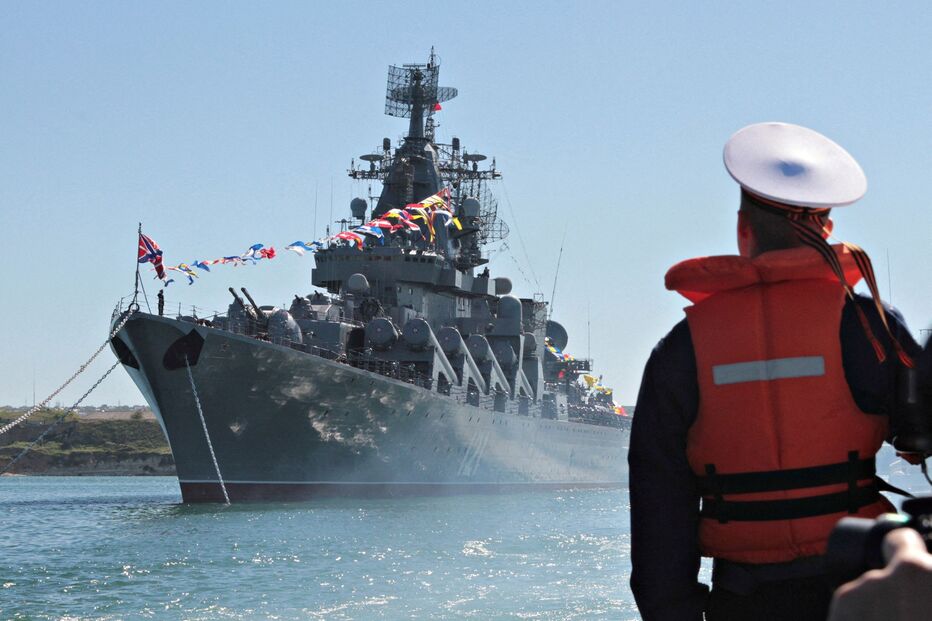 A sailor looks at the Russian missile cruiser Moskva moored in the Ukrainian Black Sea port of Sevastopol