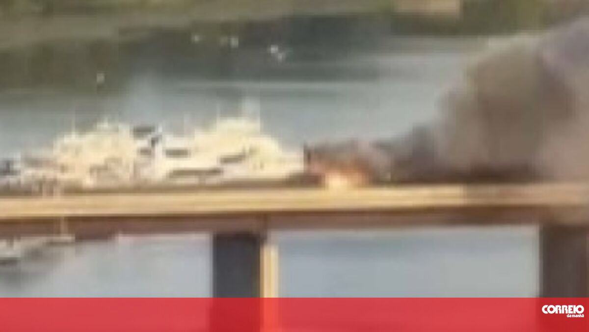 Passengers run through the windows of a burning train and jump off a bridge in Boston.