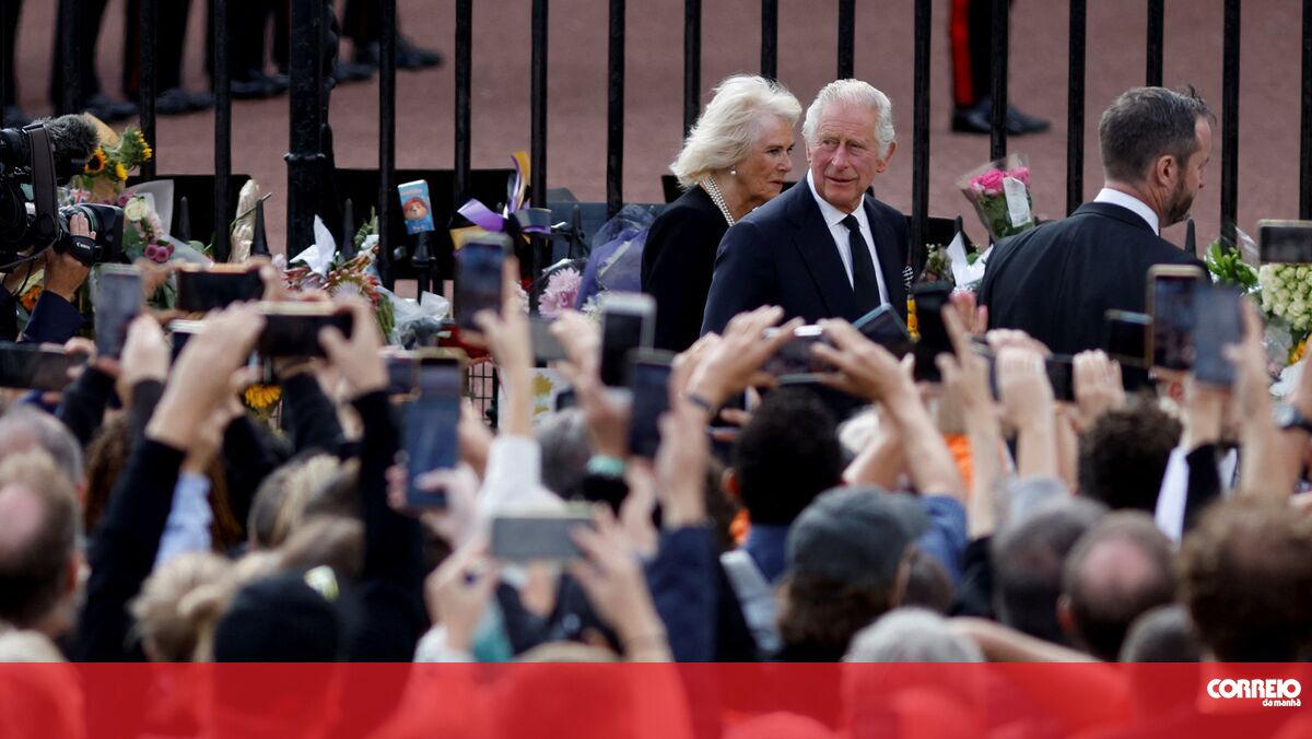 The crowd greets Charles III and Camilla upon their arrival at Buckingham Palace.