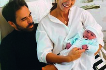 Cláudia Vieira com o companheiro, João Alves, e o pequeno Lourenço 