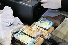 Dinheiro apreendido à rede de tráfico de droga	