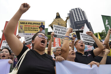 Filipinos protestam contra a corrupção nas Filipinas e exigem justiça