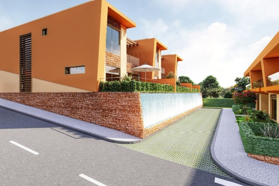 Casas modernas destacam-se numa rua soalheira com arquitetura inovadora