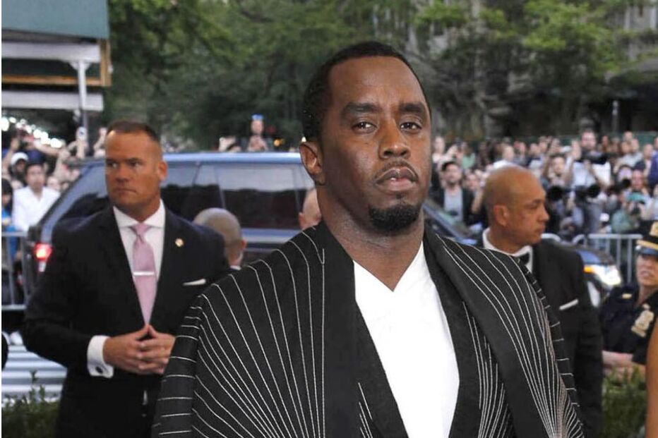 Sean 'Diddy' Combs posa com uma mulher