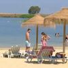 <![CDATA[ "Uma pessoa só está bem dentro de água": banhistas procuram praia fluvial de Beja durante onda de calor ]]>