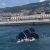 <![CDATA[ Imagens mostram resgate de homem preso em carro parcialmente submerso no mar em Trieste ]]>