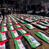 <![CDATA[ Gaza enterra 112 corpos em funeral em massa de palestinianos mortos durante ataques israelitas em 2023 ]]>