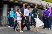 Britain's Kate, Princess of Wales, William, Prince of Wales, Prince George and Princess Charlotte, followed by Prince Louis walk during