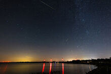 dpatop - 13 August 2026, Saxony, Klein Partwitz: Two meteors with green tails can be seen in the starry sky