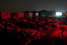 People gather to watch the Perseids meteor shower at Al