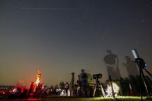 People gather to watch the Perseids meteor shower at Al