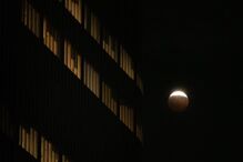 A partial lunar eclipse is seen in Los Angeles, Thursday,