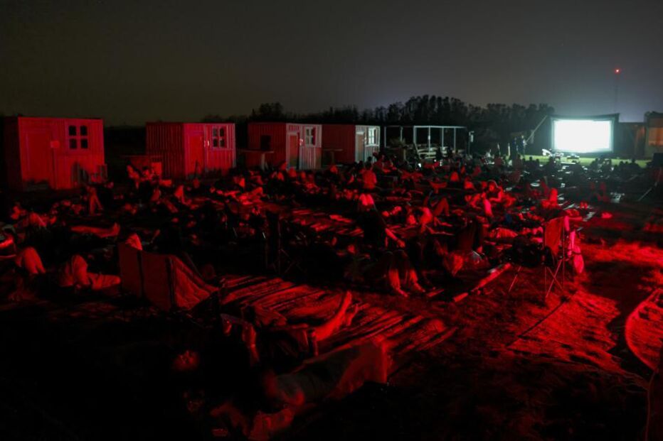 People gather to watch the Perseids meteor shower at Al