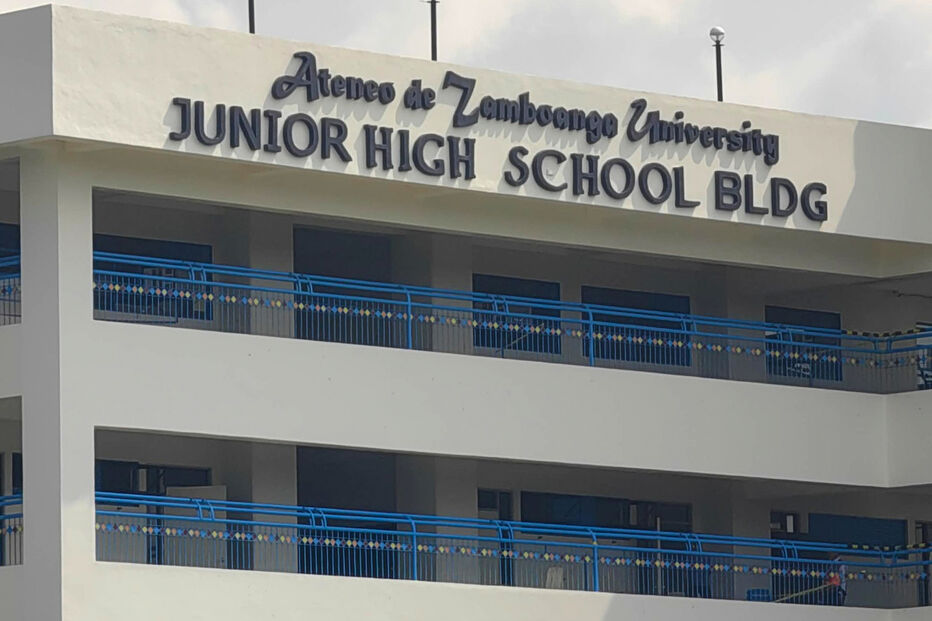 A guard secures an area at the junior high school building on the Ateneo de Zamboanga University campus following a