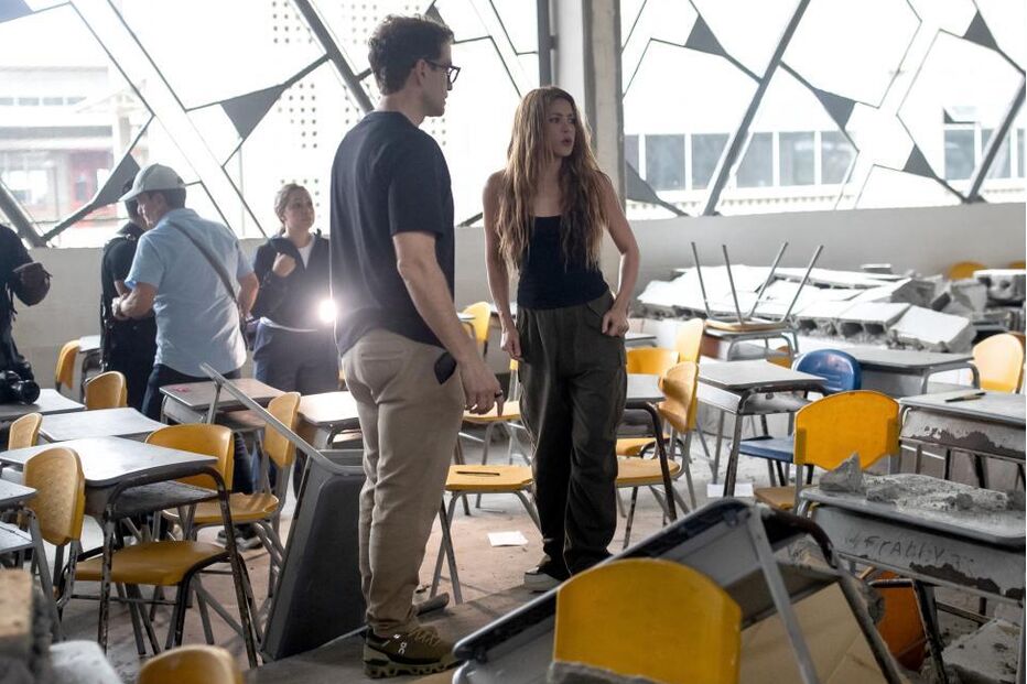 Colombian singer Shakira (C) visits the Carrasquilla Industrial Educational Institution]