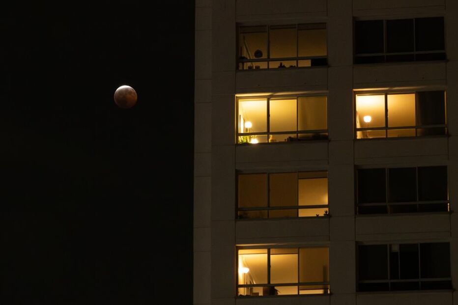 A partial lunar eclipse is seen in Los Angeles, Thursday,
