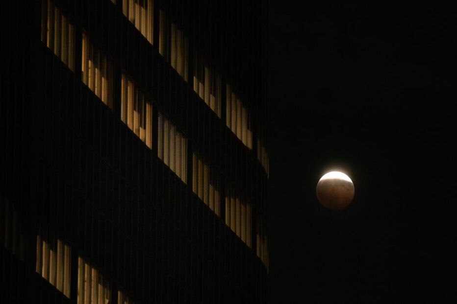 A partial lunar eclipse is seen in Los Angeles, Thursday,
