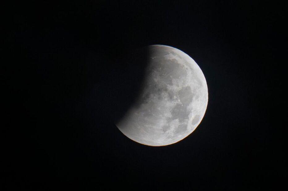 The beginning of a partial lunar eclipse is seen from