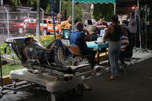 Patients lie outside a hospital after being evacuated following an earthquake in Penonome, Panama Friday, Oct. 9, 2026. (AP Photo/Aris