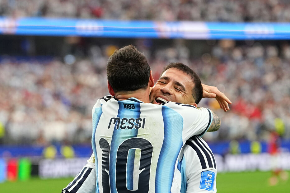 Argentina's Lionel Messi, left, celebrates with Nicolas Otamendi after scoring his side's second goal during the World Cup Group J