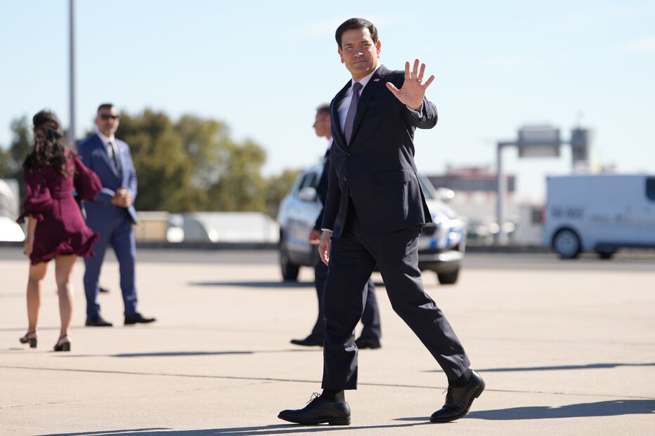 U.S. Secretary of State Marco Rubio waves on Thursday, Oct. 8, 2026, at Lisbon Airport in Lisbon. (AP Photo/Mark Schiefelbein,